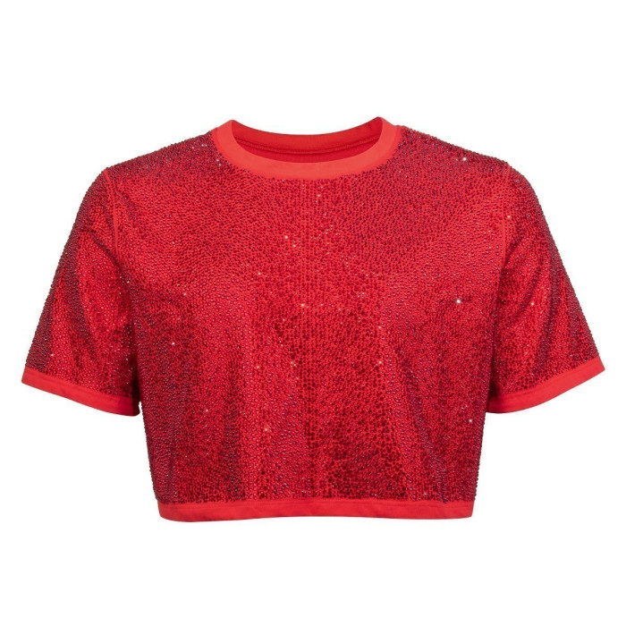 Red cropped top with short sleeves covered in rhinestones featuring a solid red ribbed neckline and hem.
