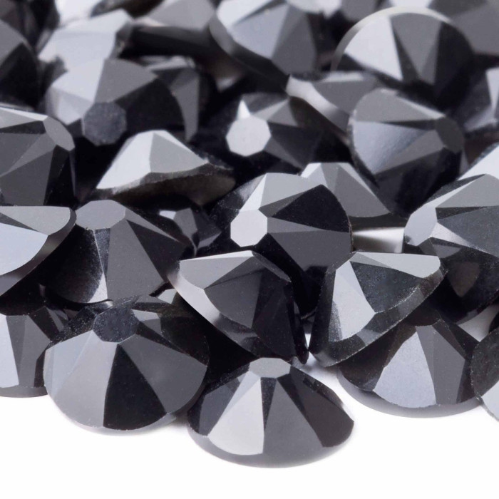 Black machine-cut rhinestones with 14 facets featuring a shiny smooth surface and a rounded flatback design.