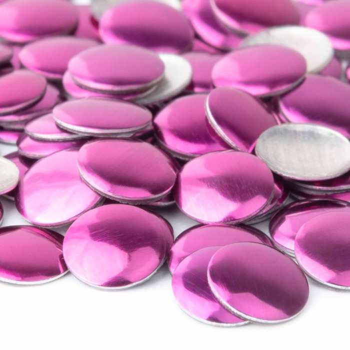Metal nailheads in a vibrant purple hue with a shiny smooth surface and silver backing arranged in a scattered layout.