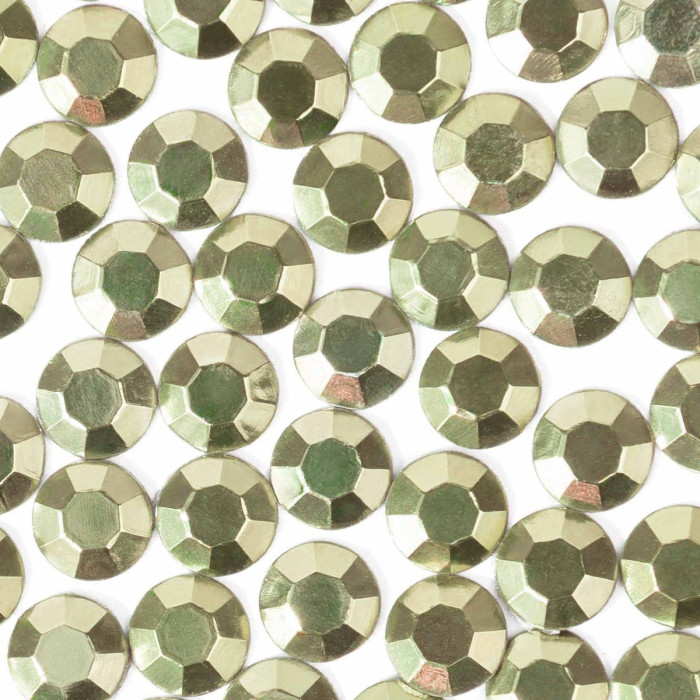 Lime green machine-cut crystal rhinestones with a faceted surface featuring a smooth shiny texture and gray glue backing.