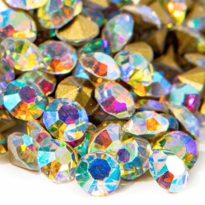 Multicolored AB pointback rhinestones with faceted surfaces displaying hues of aqua gold and rainbow reflections.