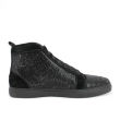 Red high-top sneakers made of leather and suede adorned with glass rhinestones featuring a smooth texture and rubber sole.