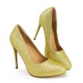 Gold glitter high heels with a pointed toe 3-inch stiletto heel and a smooth beige interior. Gold glitter high heels with a pointed toe 3-inch stiletto heel and a smooth beige interior.