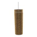 A tall silver tumbler covered in rhinestones with a clear straw and a smooth shiny surface.