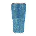 Rhinestone-encrusted double-walled stainless steel tumbler with a clear straw featuring a shimmering iridescent finish.