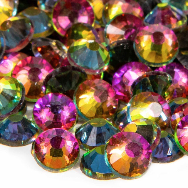 Multicolored flatback rhinestones with 12-16 facets featuring aqua pink gold and purple hues with a silver metal backing.