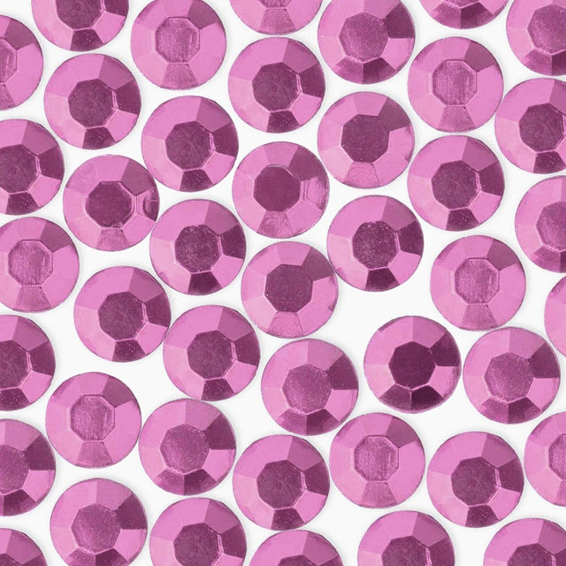 Faceted round rhinestones in light pink with a glossy finish featuring a flat back and varying shades of pink.