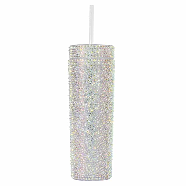 A tall silver tumbler covered in rhinestones with a clear straw and a smooth shiny surface.