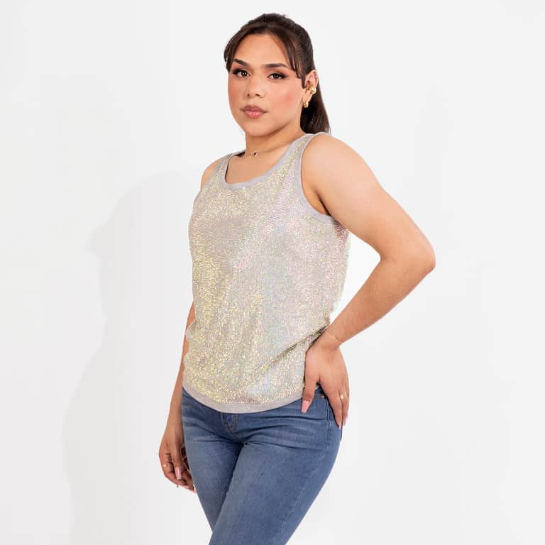 Iridescent tank top with thousands of glass rhinestones gray trim cotton blend straight-fit design worn with black pants.