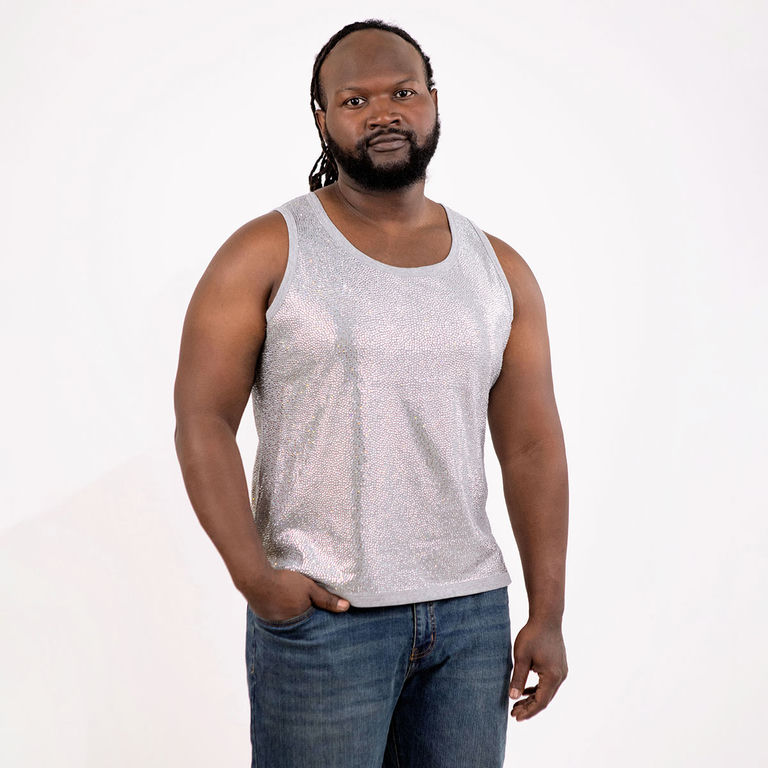 Silver tank top covered in glass rhinestones with a straight fit and a contrasting gray neckline worn with black pants.