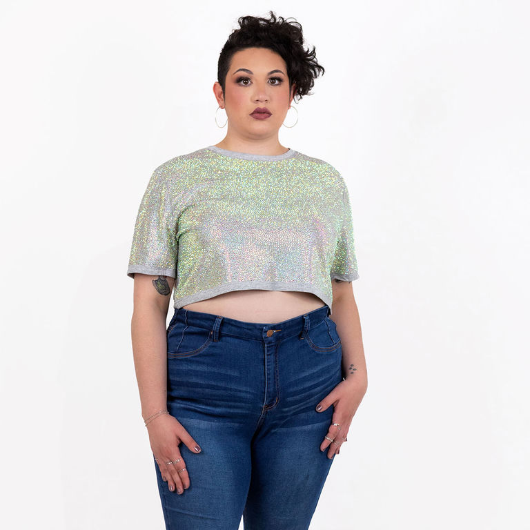 Model wearing an iridescent strass rhinestone crop top with short sleeves and a boxy fit