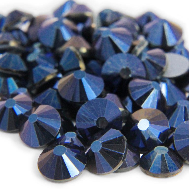 Machine&#x20;cut&#x20;crystal&#x20;rhinestones&#x20;in&#x20;deep&#x20;blue&#x20;with&#x20;a&#x20;faceted&#x20;surface&#x20;and&#x20;gray&#x20;glue&#x20;backing&#x20;varying&#x20;in&#x20;size&#x20;and&#x20;shape.