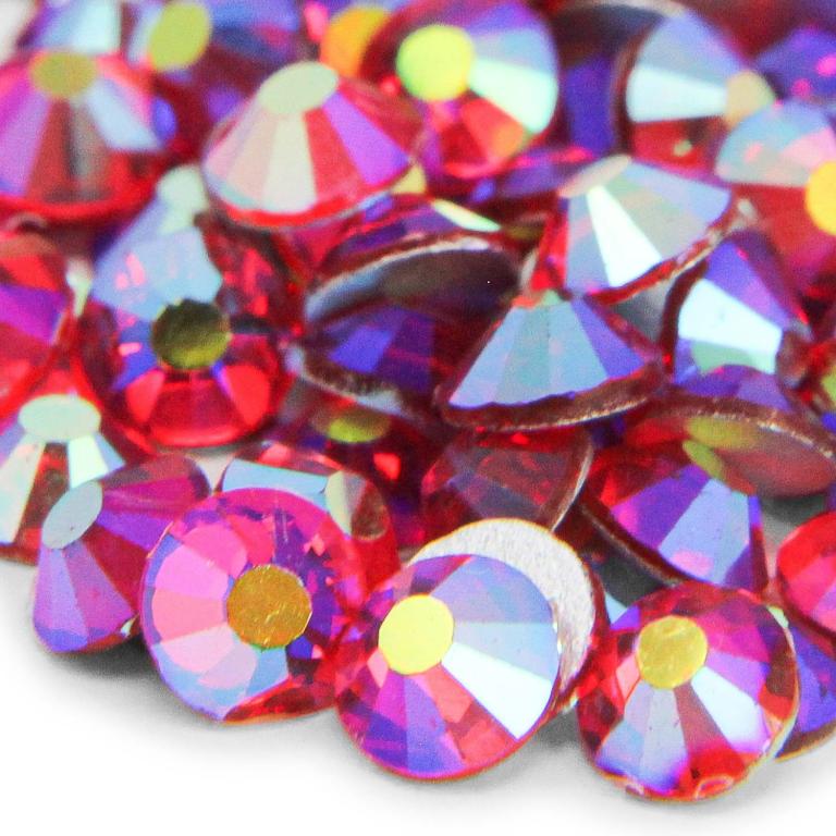Red and purple machine-cut crystal rhinestones with a faceted surface and a flat silver backing.