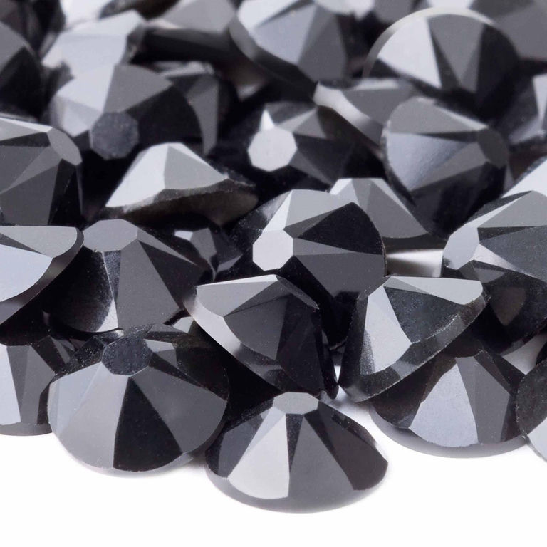 Black machine-cut rhinestones with 14 facets featuring a shiny smooth surface and a rounded flatback design.
