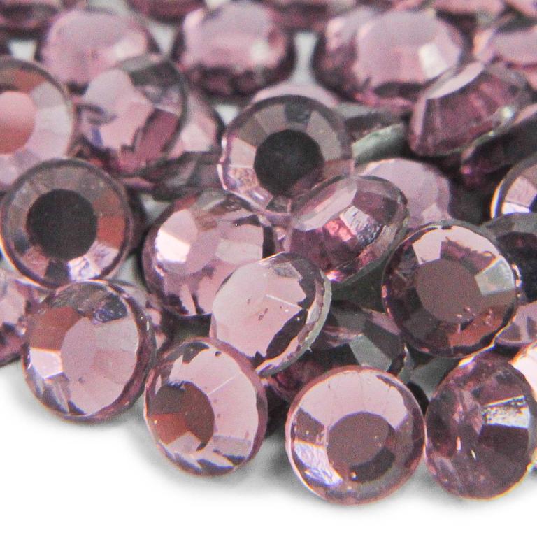 Faceted&#x20;round&#x20;glass&#x20;stones&#x20;in&#x20;light&#x20;amethyst&#x20;featuring&#x20;a&#x20;smooth&#x20;surface&#x20;and&#x20;a&#x20;strong&#x20;glue&#x20;backing&#x20;arranged&#x20;closely&#x20;together.