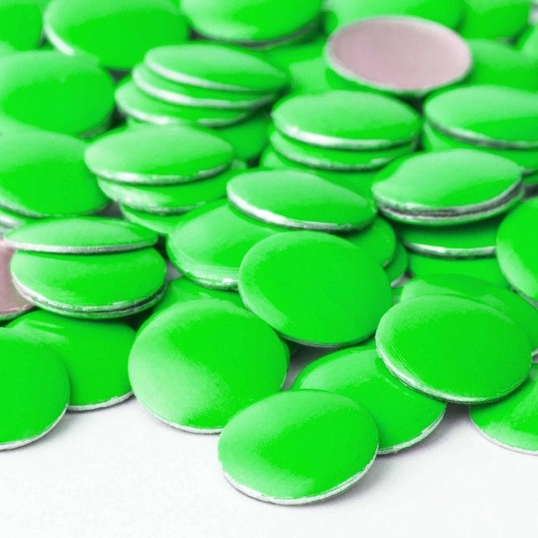 Neon&#x20;green&#x20;metal&#x20;nailheads&#x20;with&#x20;a&#x20;shiny&#x20;surface&#x20;and&#x20;silver&#x20;backing&#x20;circular&#x20;shape&#x20;arranged&#x20;in&#x20;a&#x20;scattered&#x20;pattern.