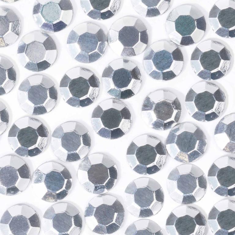 Machine-cut crystal rhinestones with a silver metallic finish round shape and faceted surface arranged closely together.