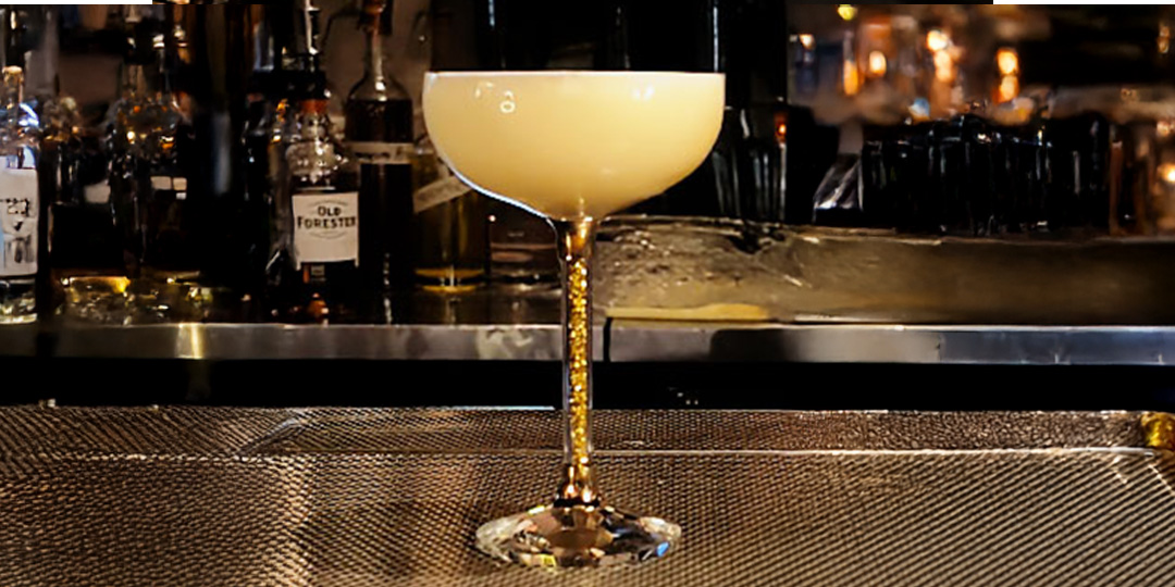 Amaretto&amp;&#x23;x20&#x3B;sour&amp;&#x23;x20&#x3B;cocktail&amp;&#x23;x20&#x3B;in&amp;&#x23;x20&#x3B;sparkling&amp;&#x23;x20&#x3B;stem&amp;&#x23;x20&#x3B;coupe&amp;&#x23;x20&#x3B;glass&amp;&#x23;x20&#x3B;with&amp;&#x23;x20&#x3B;frothy&amp;&#x23;x20&#x3B;egg&amp;&#x23;x20&#x3B;white&amp;&#x23;x20&#x3B;top