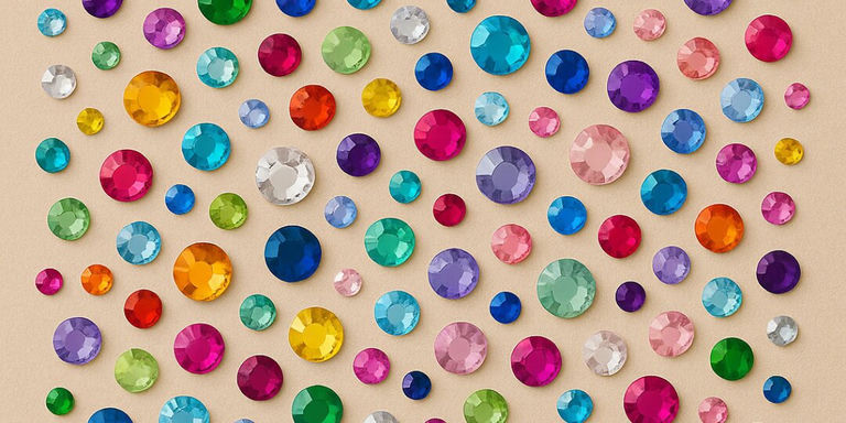 Colorful&amp;&#x23;x20&#x3B;array&amp;&#x23;x20&#x3B;of&amp;&#x23;x20&#x3B;faceted&amp;&#x23;x20&#x3B;rhinestone&amp;&#x23;x20&#x3B;gems&amp;&#x23;x20&#x3B;in&amp;&#x23;x20&#x3B;rainbow&amp;&#x23;x20&#x3B;colors&amp;&#x23;x20&#x3B;including&amp;&#x23;x20&#x3B;pink,&amp;&#x23;x20&#x3B;blue,&amp;&#x23;x20&#x3B;green,&amp;&#x23;x20&#x3B;purple,&amp;&#x23;x20&#x3B;and&amp;&#x23;x20&#x3B;gold&amp;&#x23;x20&#x3B;scattered&amp;&#x23;x20&#x3B;on&amp;&#x23;x20&#x3B;beige&amp;&#x23;x20&#x3B;background