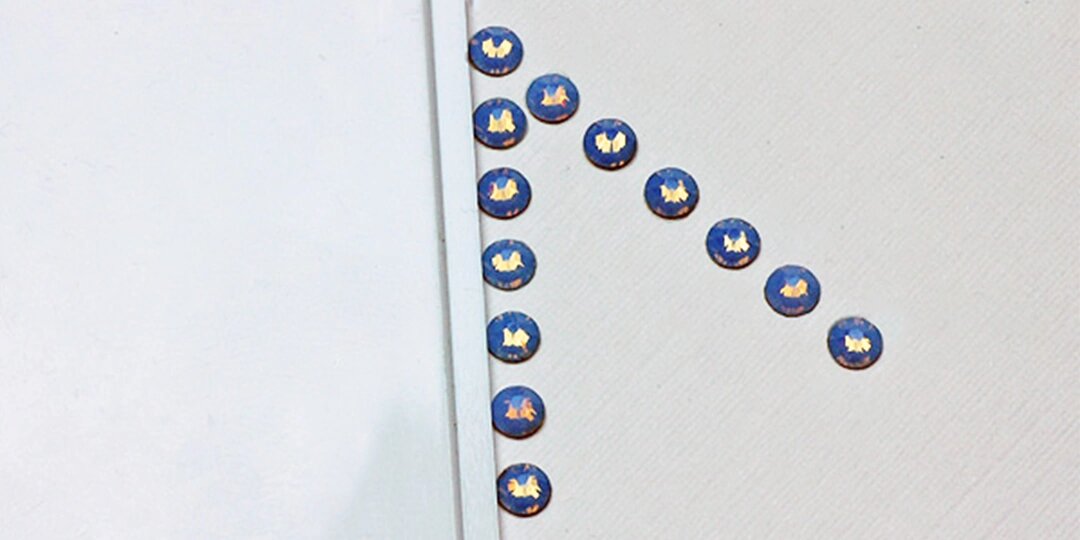 Hand&amp;&#x23;x20&#x3B;applying&amp;&#x23;x20&#x3B;rhinestones&amp;&#x23;x20&#x3B;carefully&amp;&#x23;x20&#x3B;to&amp;&#x23;x20&#x3B;a&amp;&#x23;x20&#x3B;Christmas&amp;&#x23;x20&#x3B;card&amp;&#x23;x20&#x3B;using&amp;&#x23;x20&#x3B;a&amp;&#x23;x20&#x3B;toothpick&amp;&#x23;x20&#x3B;applicator