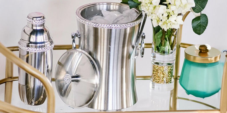 rhinestone-trimmed ice bucket and cocktail shaker styled on glam mirrored bar cart