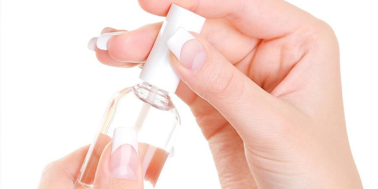 Applying base coat and polish to nails