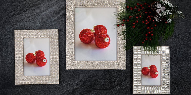 Glam rhinestone-encrusted frames on black stone with red ornaments