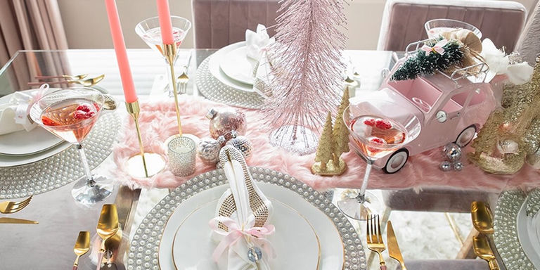 pink and gold glam holiday table with rhinestone chargers, martinis, and festive centerpiece decor