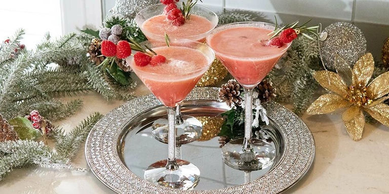 pink party punch holiday cocktails served in rhinestone-stemmed glasses on a sparkling silver tray