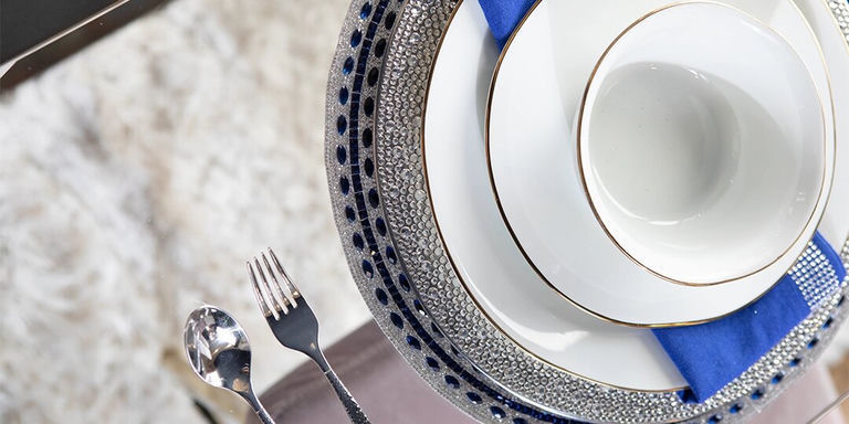 silver and blue layered place setting with rhinestone charger and cobalt napkin