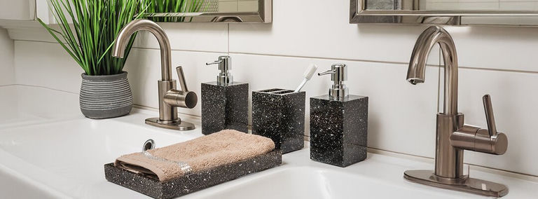 double vanity sink styled with charcoal rhinestone bathroom accessories and modern brushed nickel faucets